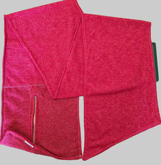 Secure pocket scarf/wrap with hidden zippered compartment for carrying essentials.